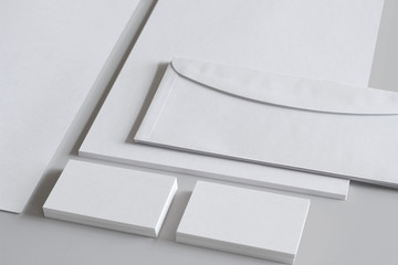blank stationery like business cards and envelops on white background