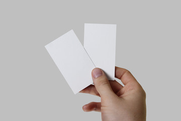 two handheld, blank business cards