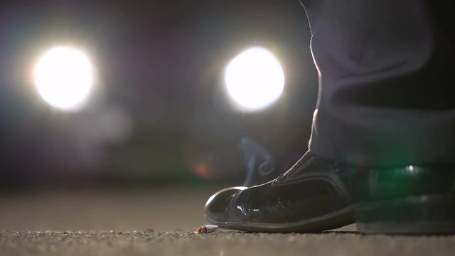 Man finishes cigarette and going to car, secret meeting at night, informant