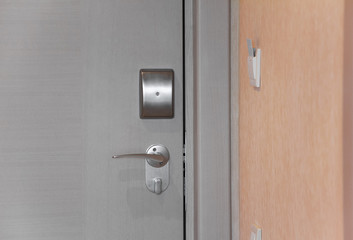 Hotel door with electronic lock, card inserted in a light switch