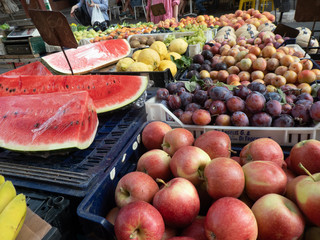 Farmers' market: watermelon, apples, plums and lemons