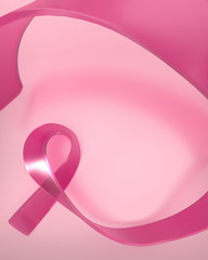 Pink glass ribbon on pink  background. Breast cancer awareness month