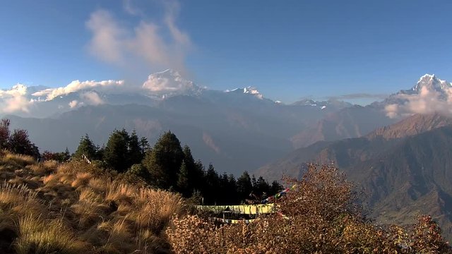 Poon hill mountains with a roadway to it in the center at day time
(TimeLapse)