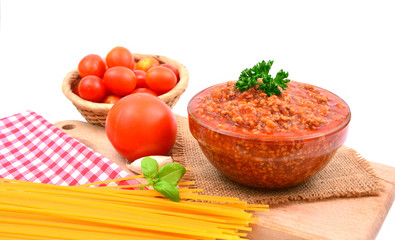 Bolognese Sauce with Spaghetti and tomatoes on white background.
