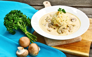 Sour mushroom sauce with bread dumpling (German name is Saure Schwammerlsoße mit Semmelknödel)