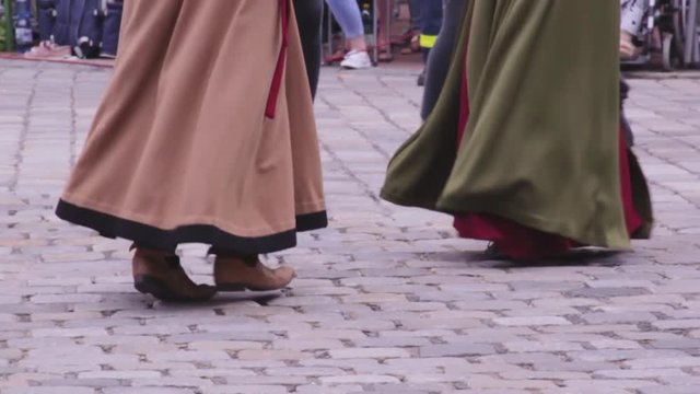 People wearing Medieval Costumes Dancing in Slow Motion on Cobblestone during Landshuter Hochzeit.