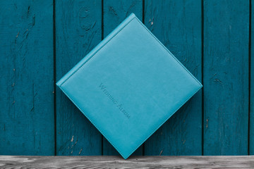 photobook with leather cover.
Photo book on a bright background.
wedding album
Photo album on a wooden surface.
