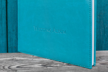 photobook with leather cover.
Photo book on a bright background.
wedding album
Photo album on a wooden surface.
