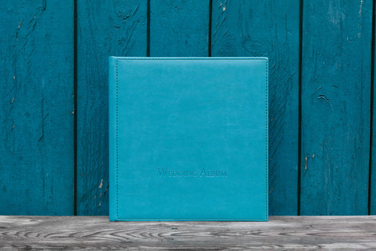 photobook with leather cover.
Photo book on a bright background.
wedding album
Photo album on a wooden surface.
