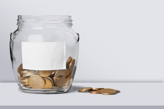 Money Jar with  coins on white background