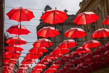 Many red umbrellas hanging in the city street Belgrade, Serbia