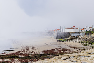 Fototapeta na wymiar Peniche, Portugal - A sudden mist bank over the coast of Peniche Portugal