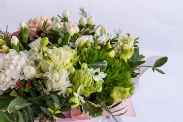 Flat lay of a beautiful florish bouquet composition on white background