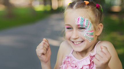 Pretty little girl with painted face