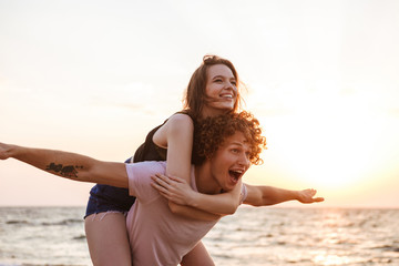 Loving couple having fun outdoors on the beach.