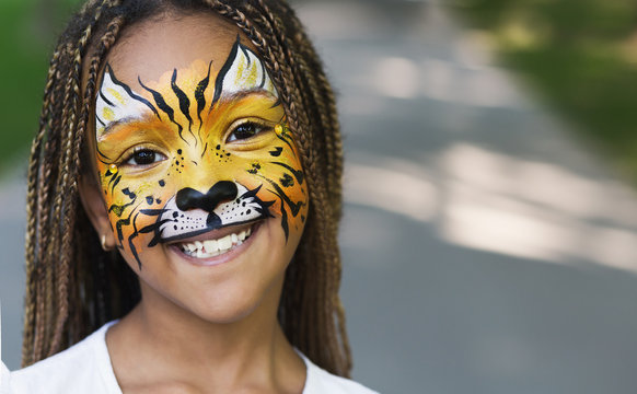 Little black girl with tiger face painting