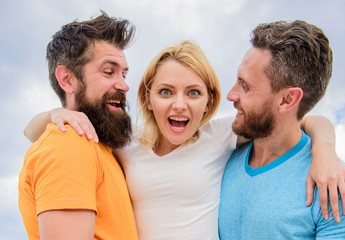 Fototapeta premium Ultimate guide to avoiding friend zone. Everything you should know to avoid friend zone and start dating. She likes male attention. Friendship issues. Girl hugs with two guys. Friendly relationships
