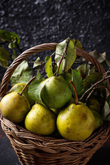 Fresh sweet organic pears in basket