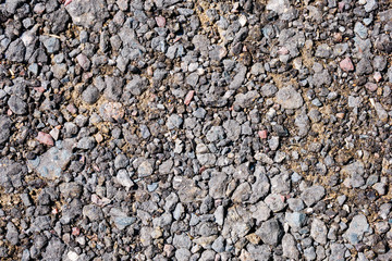 Crushed ballast gravel stone on ground. For texture and background