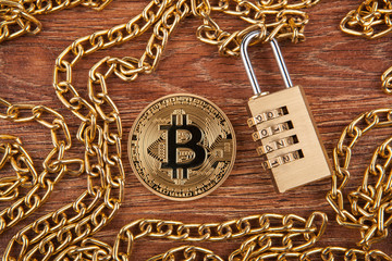 golden coin bitcoin, padlock on a gold chain top view