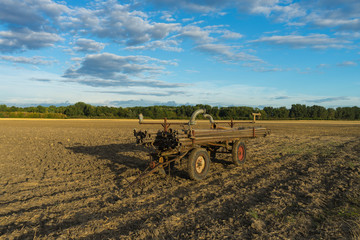 Fototapeta premium pipes for field irrigation on a wagon on a field in rheinhessen
