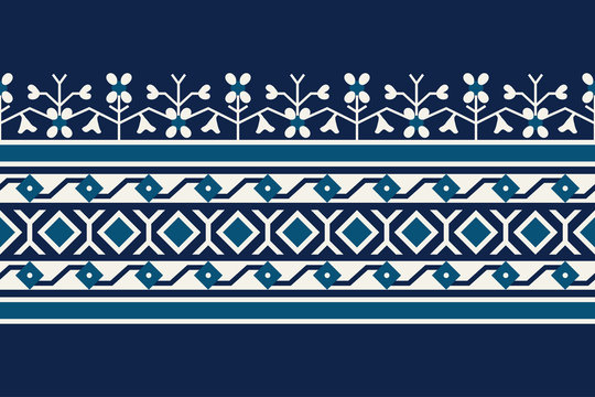 Woodblock printed seamless indigo dye ethnic floral border. Traditional oriental ornament of India , geometric floral motif, meander and diamond pattern, ecru and teal on navy blue background.