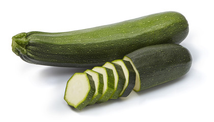 Whole and sliced zucchini isolated on white background.