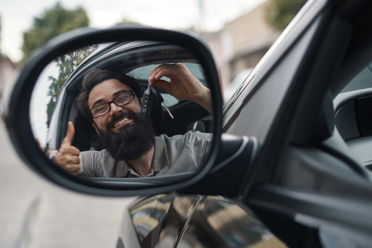 Charismatic Man Holding Car Keys 