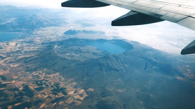  shooting from inside an airplane. and crater