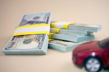 purchase auto dealership and rental car, car loan buying a new car concept. red car money