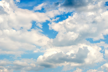 Naklejka premium Snow-white fluffy Clouds on a blue sky