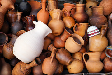 Fototapeta na wymiar Ceramic jugs, vases, mugs, different shapes and sizes.
