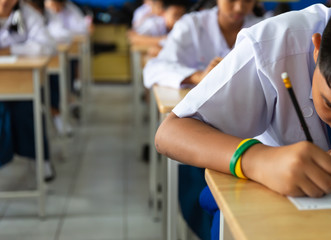 Students sit the exams in the classroom.