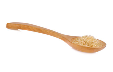Brown sugar on wooden spoon isolate on white background