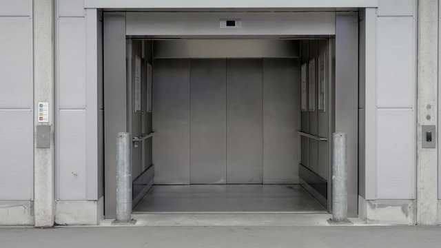 Lift doors open and show an empty elevator