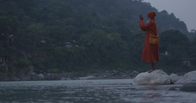 Holy man on the banks of the Ganges River, in Rishikesh, India.