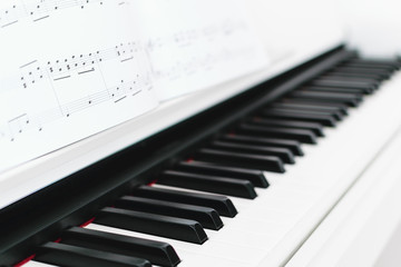 Close up of piano with song book in front