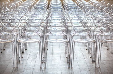 Close up of elegant contemporary designed transparent plastic chairs