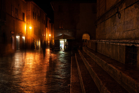 Fototapeta Old European illuminated street at rainy night