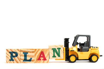 Toy forklift hold letter block N to complete word plan on white background