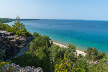 Bright beautiful landscape of Niagara Escarpment limestone cliffs along lake huron