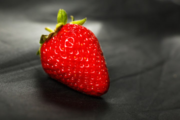 Fresh red strawberry isolated on a black background