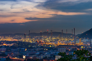 scenic of oil refinery on sunset twilight skyline