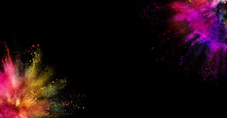 Coloured powder explosion isolated on black background