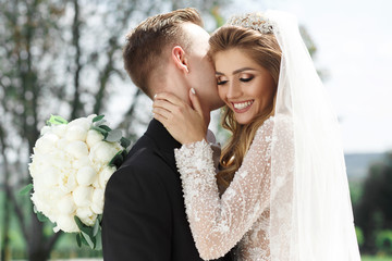 Bride and groom look awesome posing in the garden