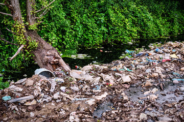 small river full of garbage