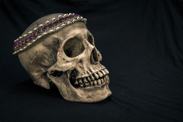 Still life with a human skull with the old, in with the diamond and jewelry