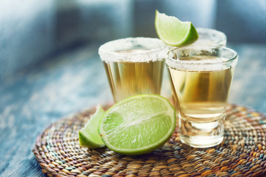 Tequila and slice of lime on a blurry background