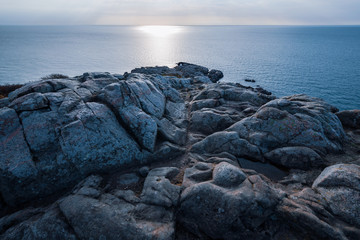Distant small lighthouse on the cliffs