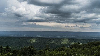 Fototapeta na wymiar Ominous clouds over a mountain landscape